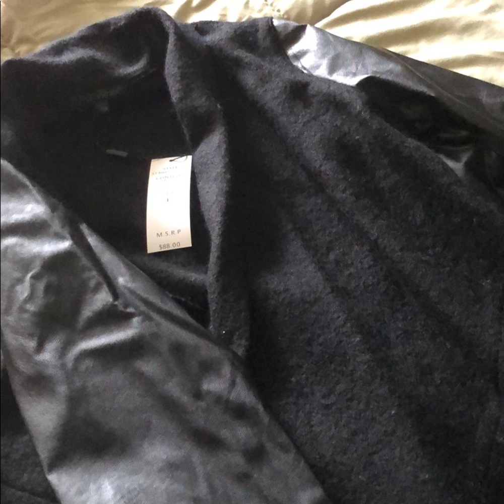 Faux leather sleeves and wool sweater coat
